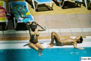 Girls sunbathe topless near the pool. Thumbnail 10