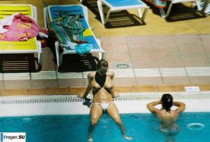 Girls sunbathe topless near the pool. Thumbnail 12