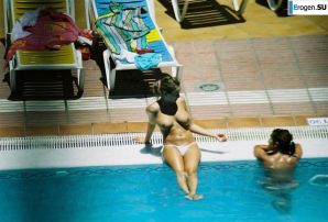 Girls sunbathe topless near the pool. Thumbnail 14