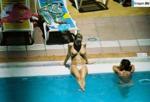 Girls sunbathe topless near the pool. Thumbnail 15
