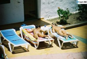 Girls sunbathe topless near the pool. Thumbnail 16