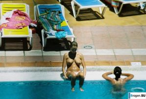 Girls sunbathe topless near the pool. Thumbnail 17