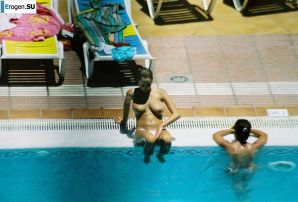 Girls sunbathe topless near the pool. Thumbnail 18