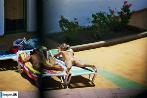 Girls sunbathe topless near the pool. Thumbnail 21