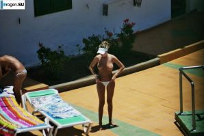 Girls sunbathe topless near the pool. Thumbnail 23