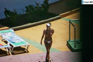 Girls sunbathe topless near the pool. Thumbnail 25