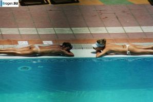 Girls sunbathe topless near the pool. Thumbnail 26