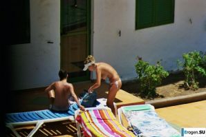 Girls sunbathe topless near the pool. Thumbnail 31