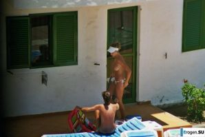 Girls sunbathe topless near the pool. Thumbnail 32