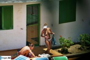 Girls sunbathe topless near the pool. Thumbnail 34
