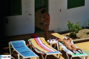 Girls sunbathe topless near the pool. Thumbnail 35