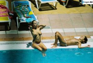 Girls sunbathe topless near the pool. Thumbnail 6