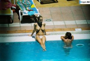 Girls sunbathe topless near the pool. Thumbnail 7