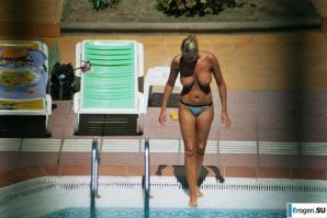 Girls sunbathe topless near the pool. Part 2. Thumbnail 12