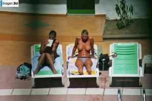 Girls sunbathe topless near the pool. Part 2. Thumbnail 15