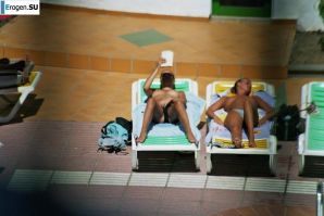 Girls sunbathe topless near the pool. Part 2. Thumbnail 16