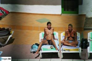 Girls sunbathe topless near the pool. Part 2. Thumbnail 19