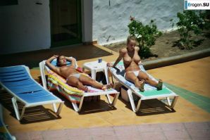 Girls sunbathe topless near the pool. Part 2. Thumbnail 20