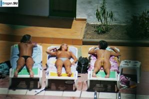 Girls sunbathe topless near the pool. Part 2. Thumbnail 27