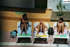 Girls sunbathe topless near the pool. Part 2. Thumbnail 39