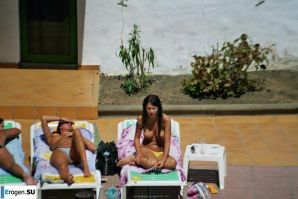 Girls sunbathe topless near the pool. Part 2. Thumbnail 4