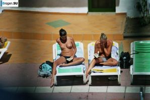 Girls sunbathe topless near the pool. Part 2. Thumbnail 8