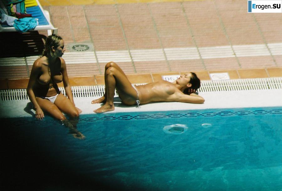 Girls sunbathe topless near the pool. Part 3. Slide 28