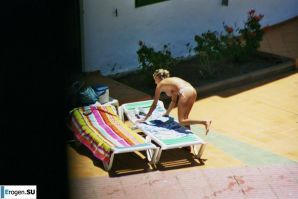 Girls sunbathe topless near the pool. Part 3. Thumbnail 1