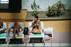 Girls sunbathe topless near the pool. Part 3. Thumbnail 16