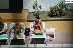 Girls sunbathe topless near the pool. Part 3. Thumbnail 17