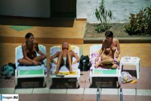 Girls sunbathe topless near the pool. Part 3. Thumbnail 2