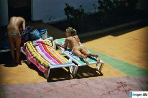 Girls sunbathe topless near the pool. Part 3. Thumbnail 23