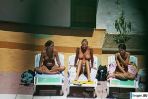 Girls sunbathe topless near the pool. Part 3. Thumbnail 3