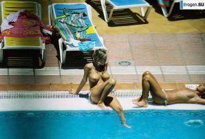 Girls sunbathe topless near the pool. Part 3. Thumbnail 33