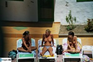 Girls sunbathe topless near the pool. Part 3. Thumbnail 4