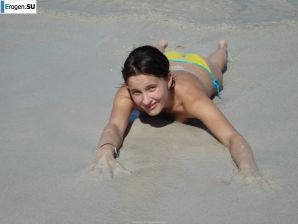 resting naked on the beach. Thumbnail 10