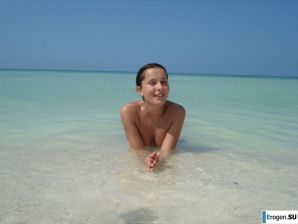 resting naked on the beach. Thumbnail 32