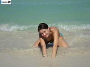 resting naked on the beach. Thumbnail 8
