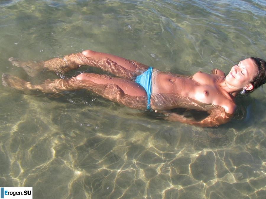 tanned girlfriends on a rocky shore. Slide 17