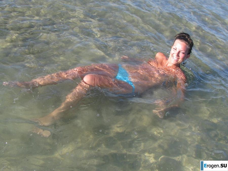 tanned girlfriends on a rocky shore. Slide 19