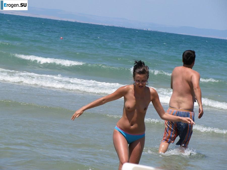 tanned girlfriends on a rocky shore. Slide 2