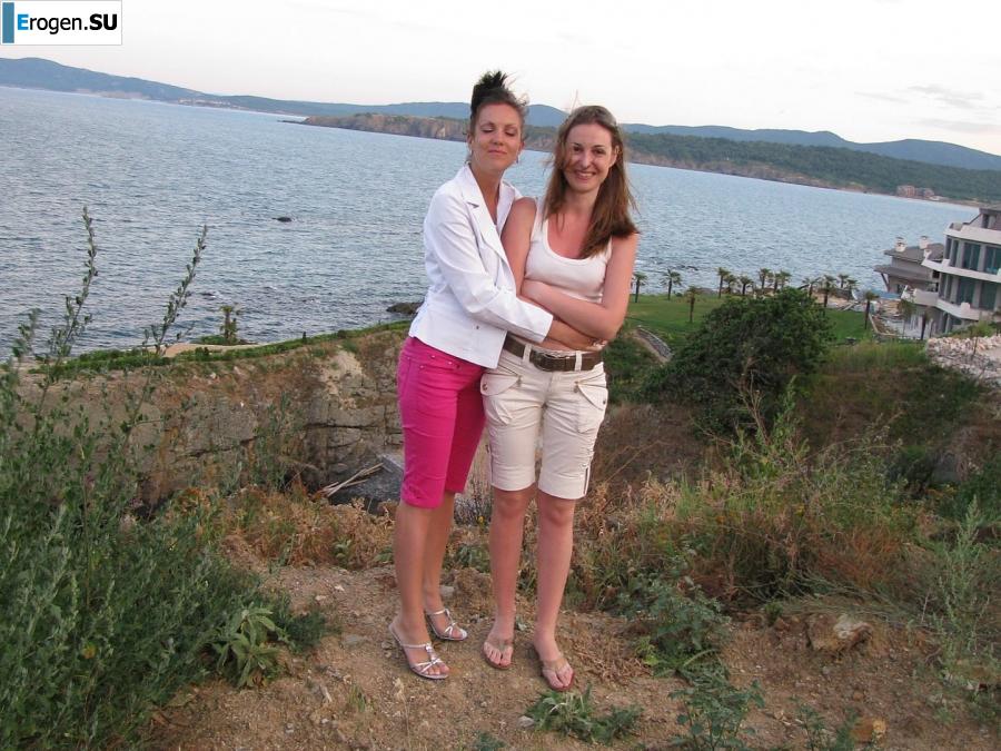 tanned girlfriends on a rocky shore. Slide 39
