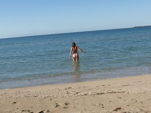 undressed on a deserted beach. Thumbnail 13