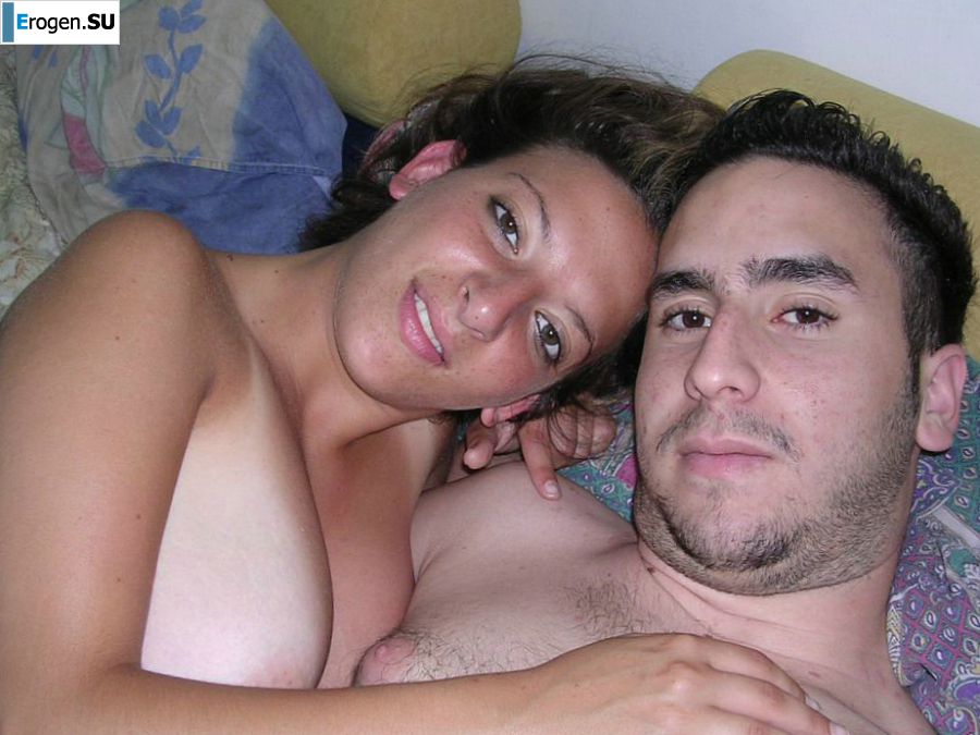 A tanned brunette shines her tits in the morning in bed. Slide 19