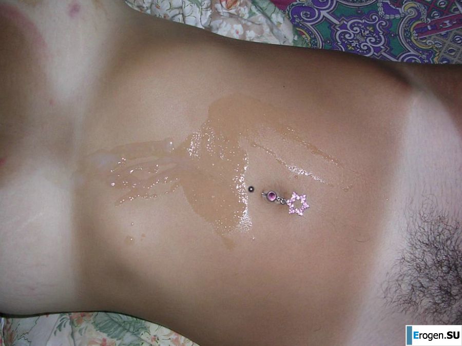 A tanned brunette shines her tits in the morning in bed. Slide 30