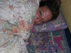 A tanned brunette shines her tits in the morning in bed. Thumbnail 13