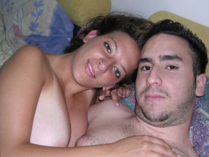 A tanned brunette shines her tits in the morning in bed. Thumbnail 19