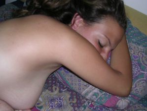 A tanned brunette shines her tits in the morning in bed. Thumbnail 23