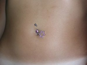 A tanned brunette shines her tits in the morning in bed. Thumbnail 24