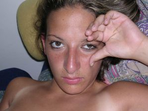 A tanned brunette shines her tits in the morning in bed. Thumbnail 27